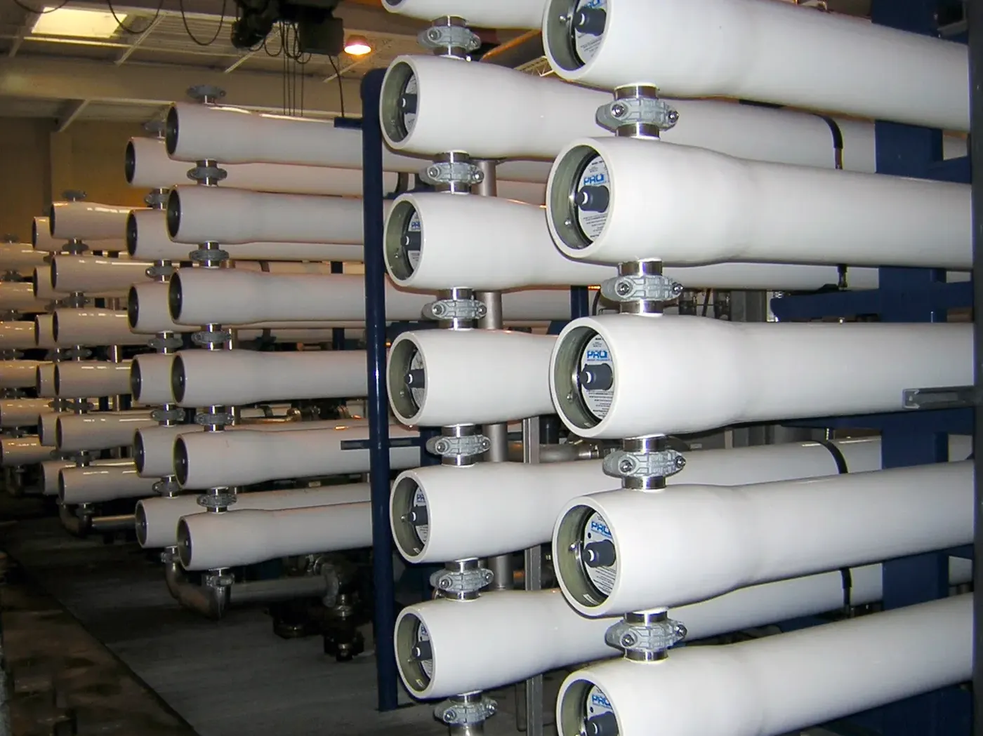 A rack of filament-wound FRP membrane pressure vessels in a reverse osmosis train